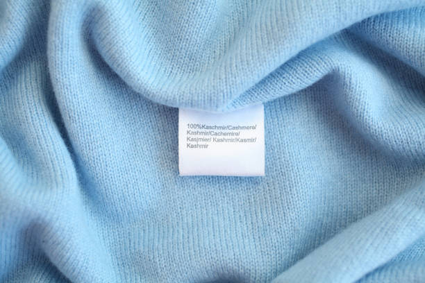 light blue cashmere fabric closeup with tag 100% cashmere